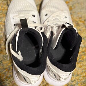 Men’s White and Black Nike athletic shoes